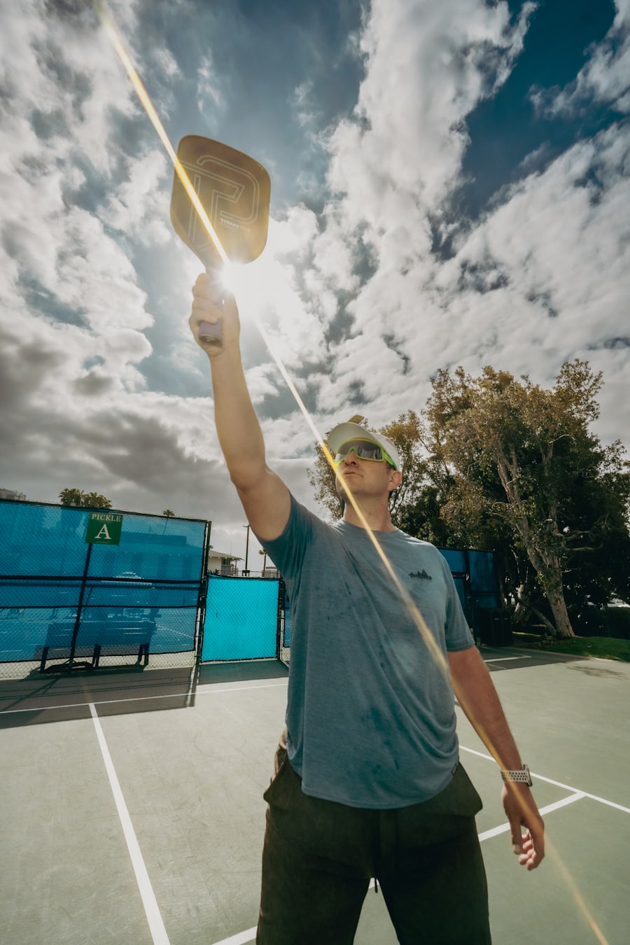 A pickleball player at the kitchen line on a sunny outdoor court — capturing the joy of the sport that powers the gift